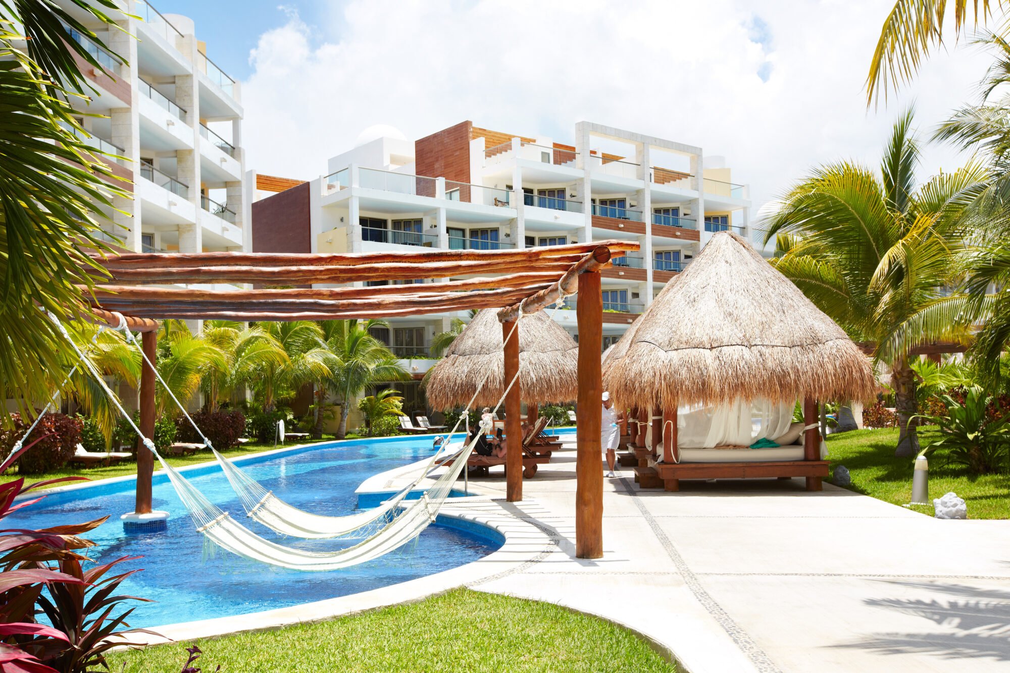 Swimming pool and hammock. Luxury exotic resort.