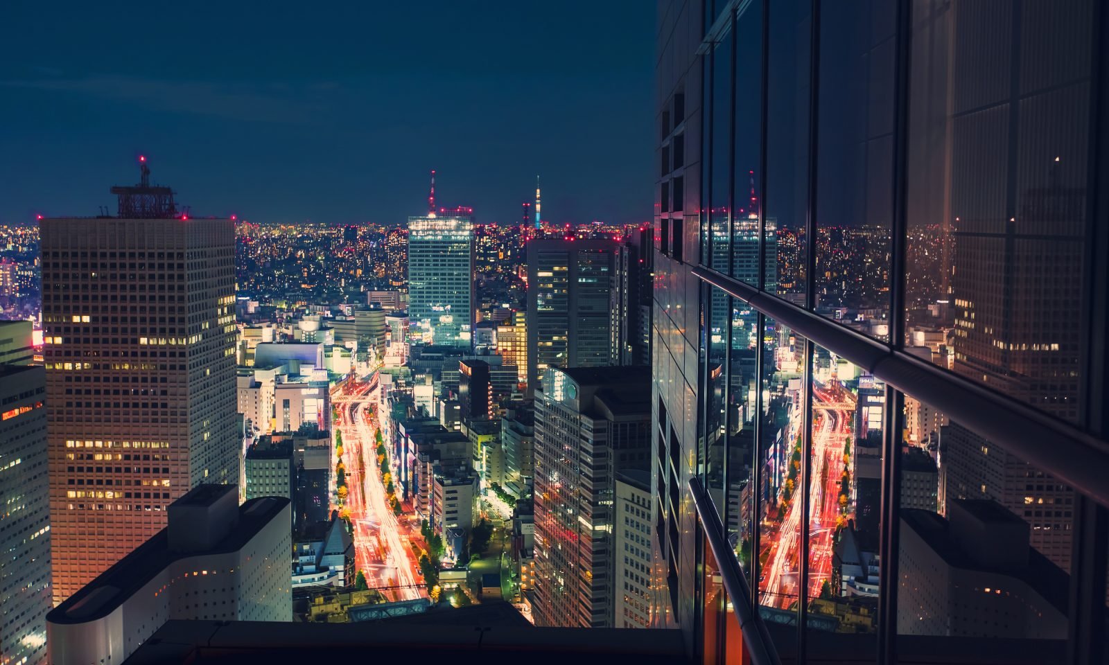 Aerial View Cityscape At Night In Tokyo, Japan From A Skyscraper