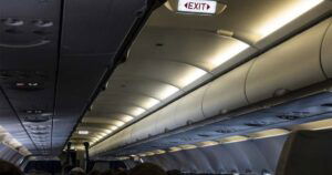 airplane cabin with lights dimmed