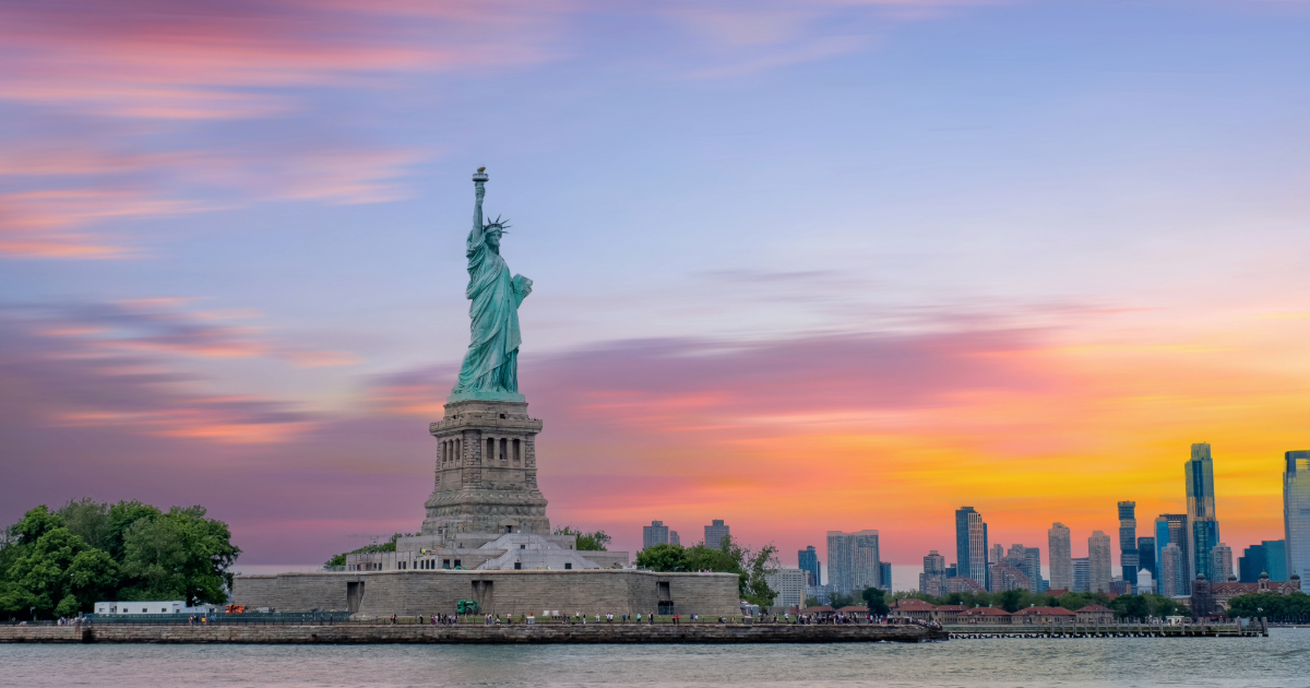 Shutterstock Statue of Liberty at sunset and Manhattan skyline, New York City