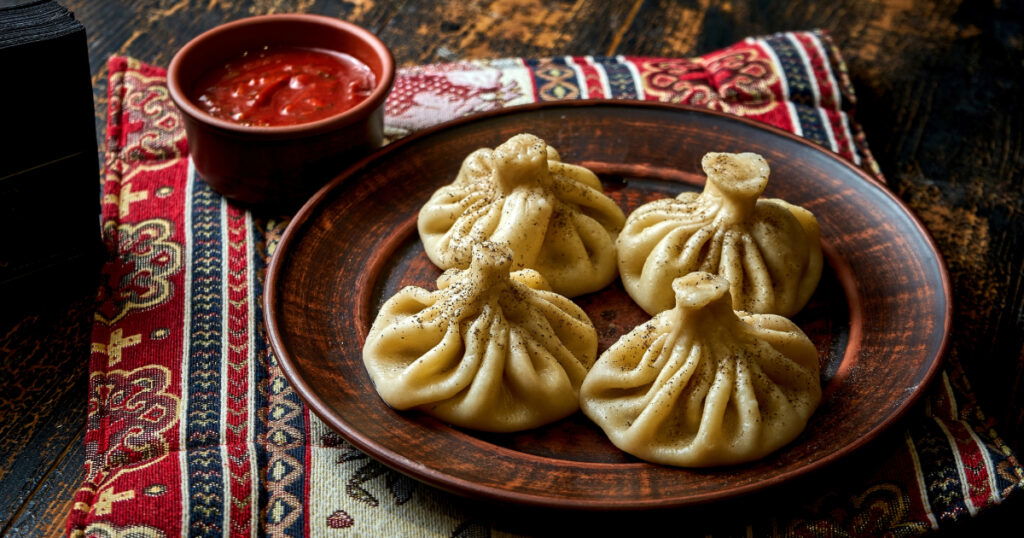 Shutterstock Khinkali with meat filling in a plate