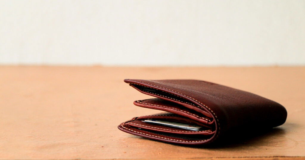 Shutterstock Brown leather wallet put on wooden table top