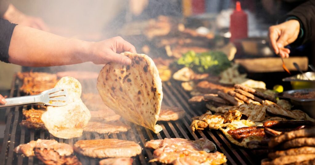 Shutterstock Traditional Balkan food cooking on a grill