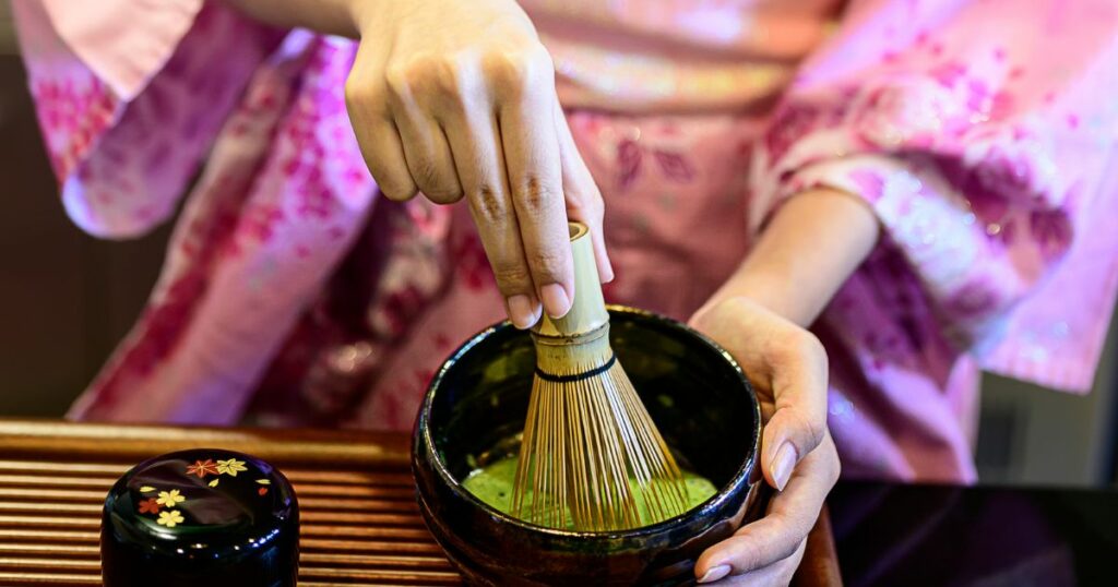 Shutterstock Beautiful woman dressed in a Kimono, making green tea, matcha