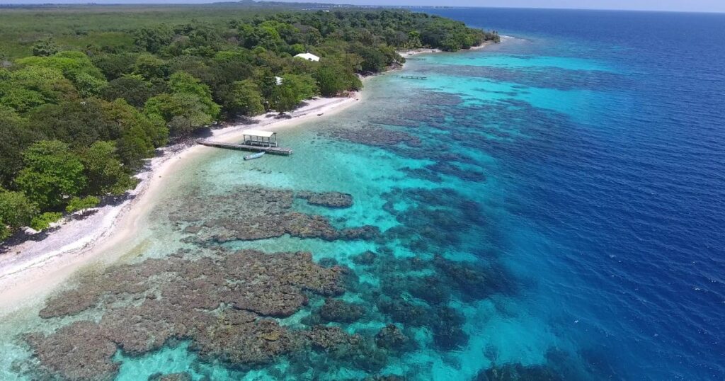 Shutterstock An aerial view of a beautiful island in Honduras with coral reefs