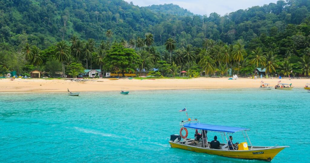 Shutterstock A boat leaving Tioman Island, Malaysia