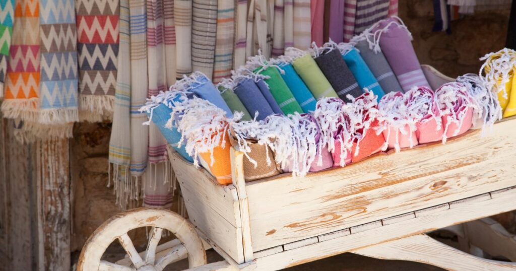 Shutterstock Multicolored Turkish bath towels, traditional natural cotton hammam towels in a wooden cart.