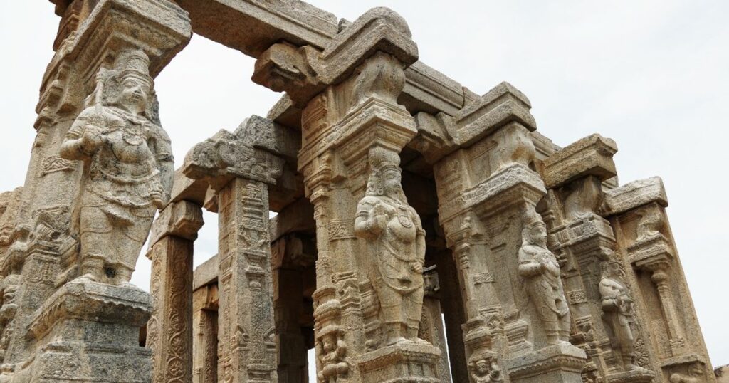 Shutterstock Exquisitely carved beautiful bas-relief of Hindu Gods on stone pillars at the ancient Veerabhadra temple at Lepakshi in Andhra Pradesh