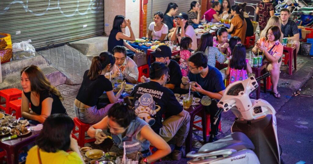 Shutterstock People enjoying street food in Ho Chi Minh