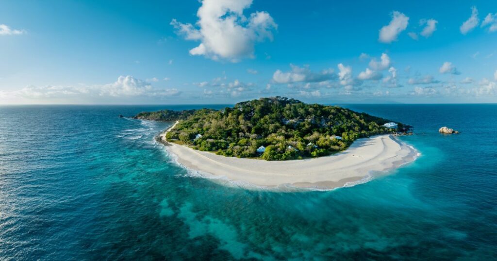 Shutterstock Aerial view of a tropical paradise luxury resort on Cousine Island, villas and private beach, Seychelles