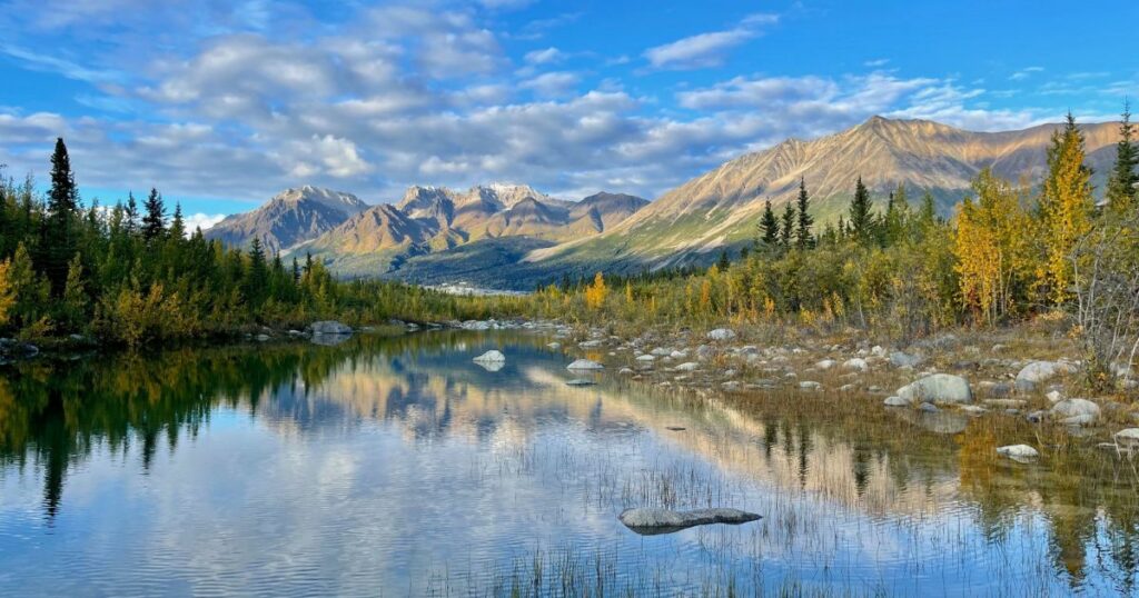 Shutterstock A beautiful lake in Wrangell, St Elias National Park, Alaska, with mountains in the background