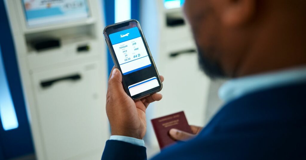 Shutterstock A person checking flight info on his phone