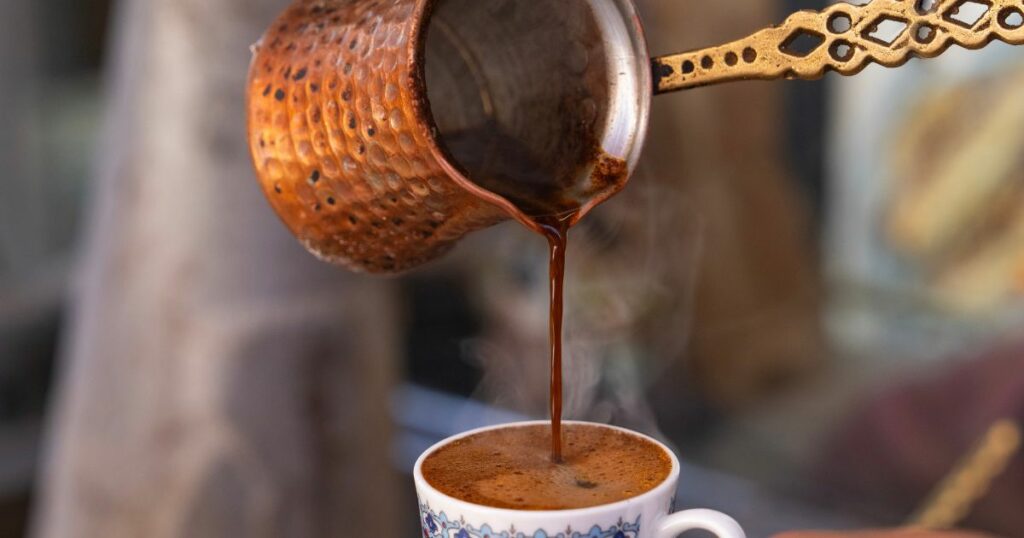 Shutterstock A person serving Turkish coffee