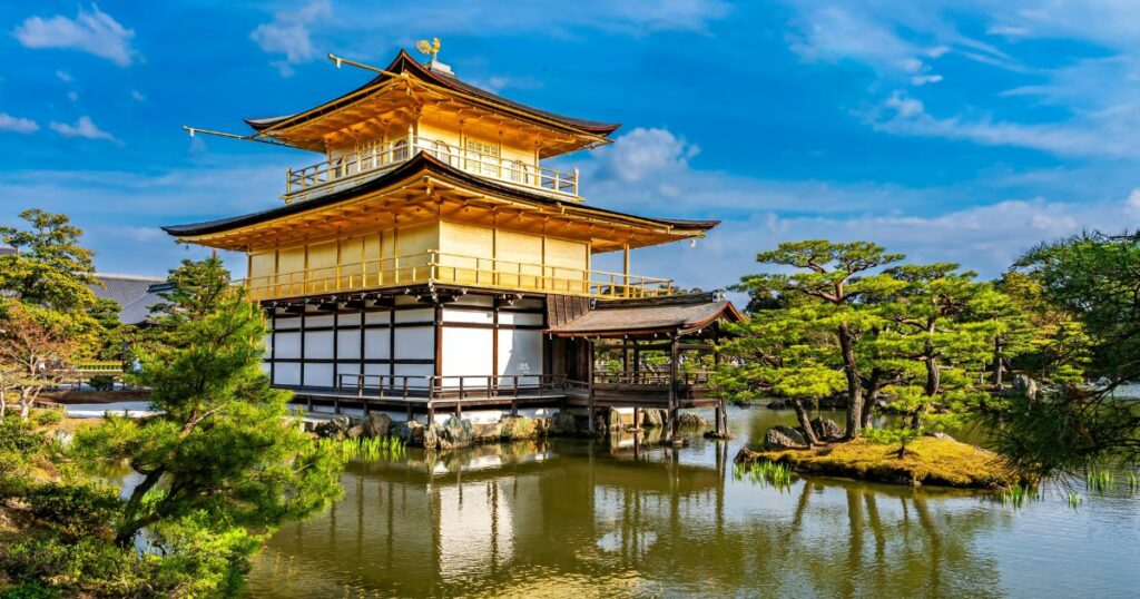 Shutterstock Kinkakuji Temple by the pond surrounded with Japanese garden