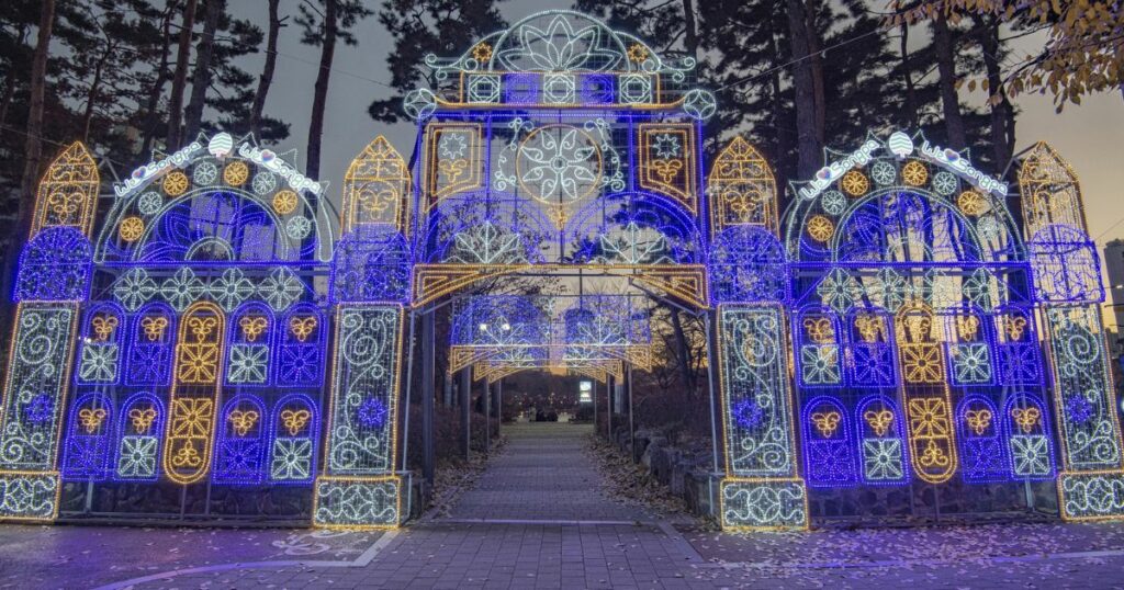 Shutterstock Night view of white and blue LED Luminarie light on the entrance door against trail and pine trees at Seokchon Lake