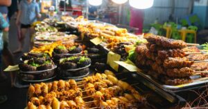 A stall with various delicacies at the night market in Vietnam