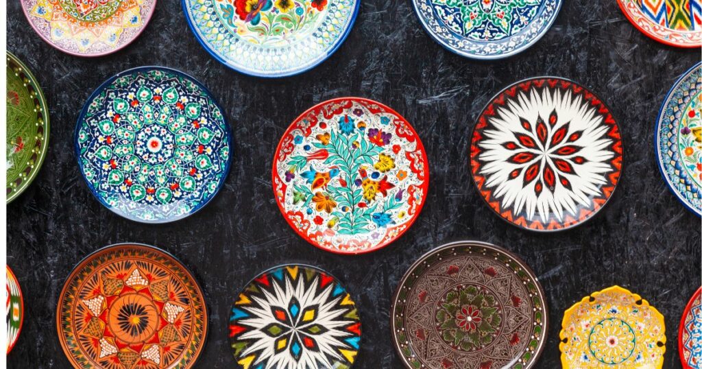 Shutterstock Painted ceramic plates hanging on the wall