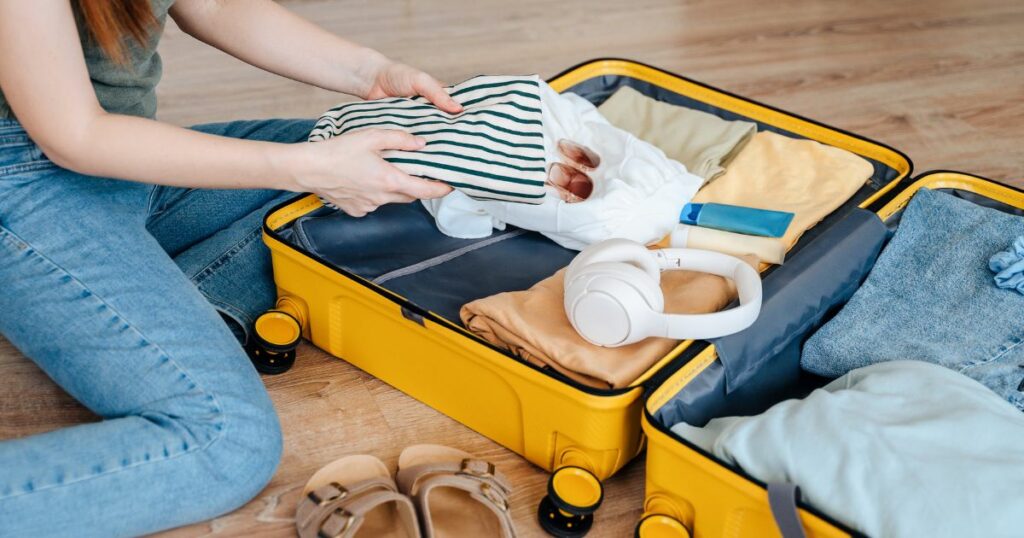 Shutterstock A woman packing her suitcase