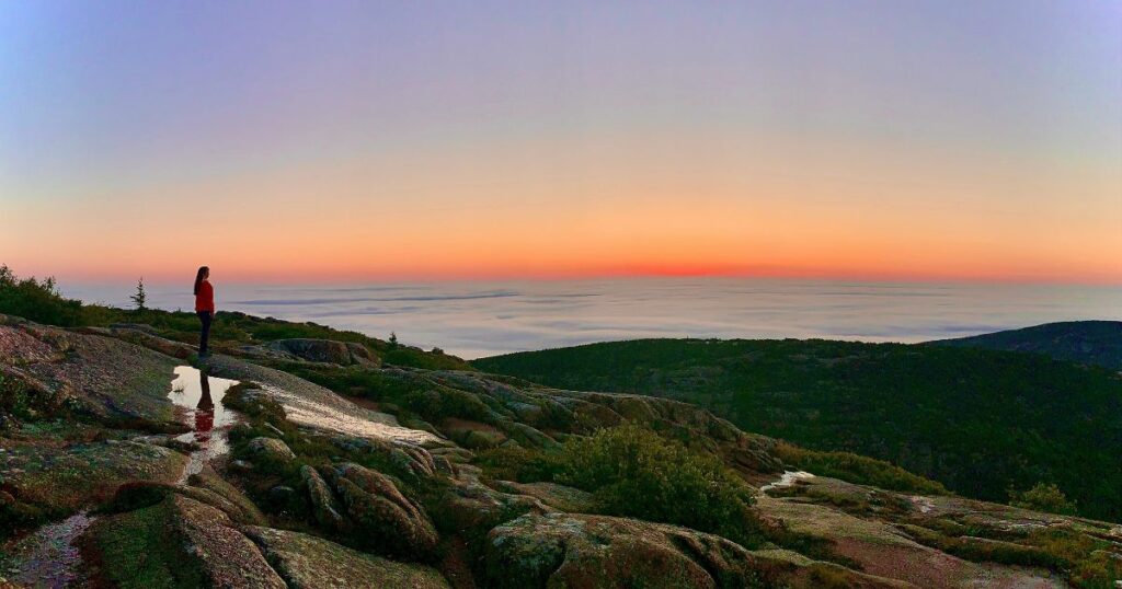 Shutterstock Sunrise at Cadillac Mountain in Acadia National Park, Maine