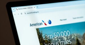 New York, USA - December 15, 2024: American Airlines website homepage displayed on computer screen with visible logo. Online platform for flight booking, travel rewards, and airline services