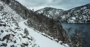 Snow covered carriage trail in winter in Acadia National Park