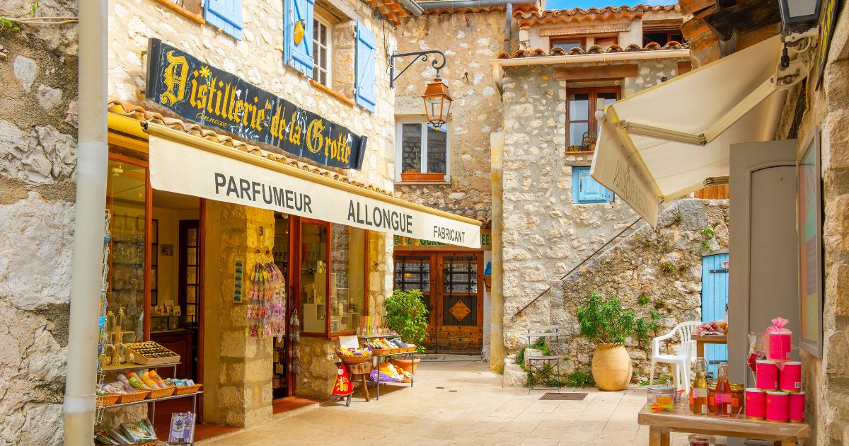 Gourdon, Alpes-Maritimes, France - May 12 2024: A picturesque street of medieval buildings with charming shops and homes in the Provence hill town of Gourdon, France, in the Alpes-Maritimes region.