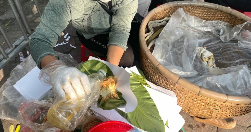 Shutterstock Famous Vietnamese street food, sticky rice being served on the side of the road