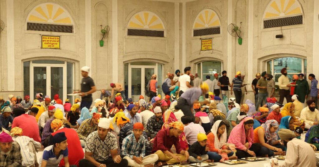 Shutterstock People having meal inside a Gurdwara