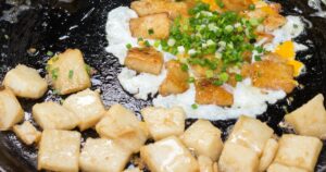 'Bot Chien' Fried rice flour cake with eggs, Vietnamese street food in Ho Chi Minh city.