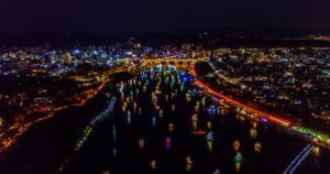 Jinju, South korea - October 2017 : Night time scenery of Jinju Namgang Yudeung Festival in Jinju city, South korea. Scenery has many lanterns that are floating in the river. Have dust and noise in view