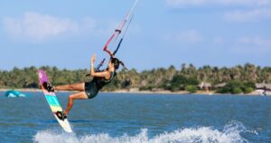 Kitesurfer girl is having while she is surfing in Kalpitiya.