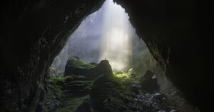 Shaft of light beaming down into Son Doong, the world's largest cave