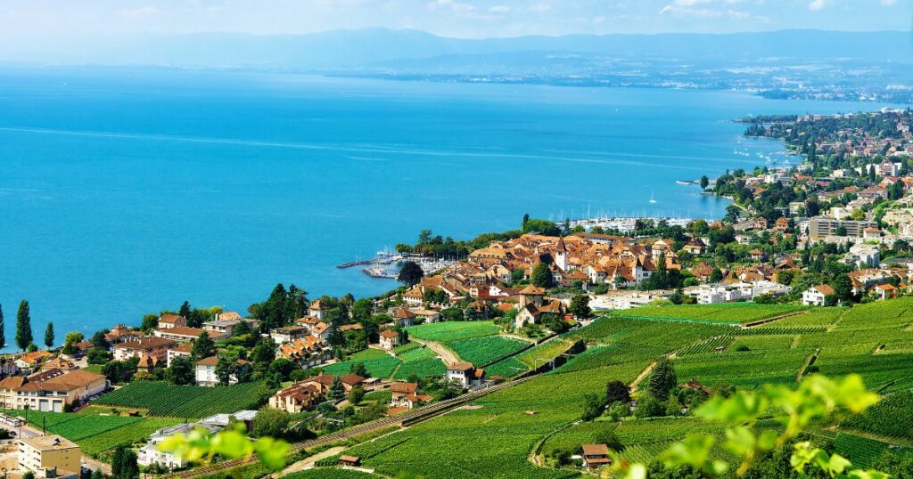 Shutterstock Chalets in Vineyard Terraces hiking trail of Lavaux, Lake Geneva and Swiss mountains, Lavaux-Oron district, Switzerland