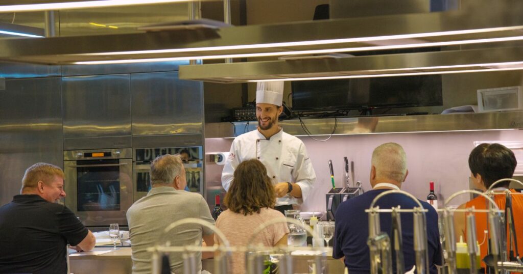 Shutterstock People listening to an instructor during a cooking class in Italy