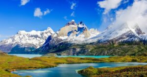 Beautiful Patagonia landscape of Andes mountain range, winding road and lake at Torres del Paine National Park, Chile.