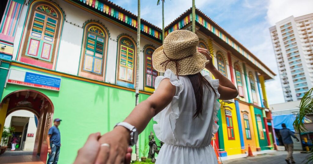 Shutterstock A couple in the vibrant Little India district in Singapore