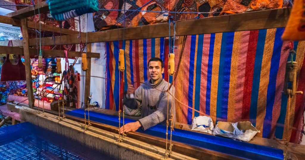 Shutterstock Local artisan weaving with traditional frame and creating handmade textile in old Medina market