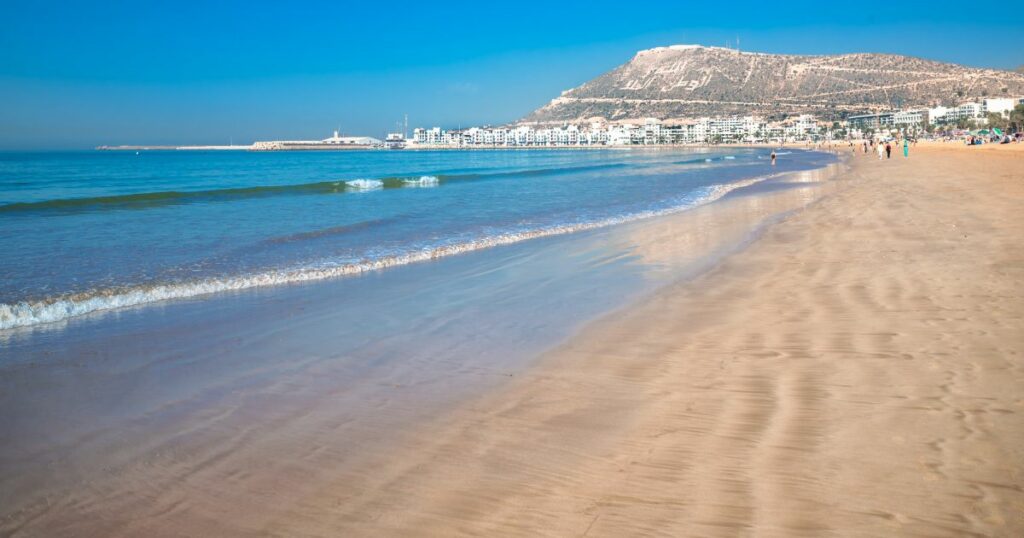 Shutterstock Agadir beach on the Atlantic African coast in the summertime with yellow sand and turquoise water in Morocco