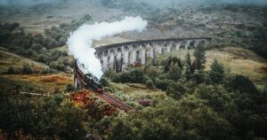 A train on a scenic bridge in Scotland