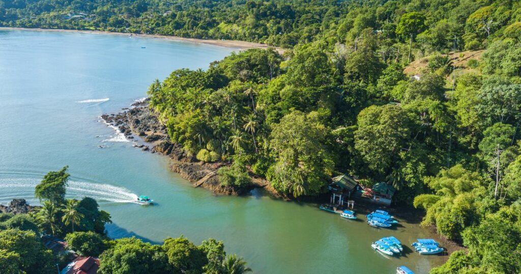 Shutterstock Bahia Drake, Peninsula de Osa, Puntarenas, Costa Rica - Aerial Drone Shot of famous Drake Bay near Corcovado National Park at river mouth with boat dock of Aguila de Osa Rainforest Eco Lodge