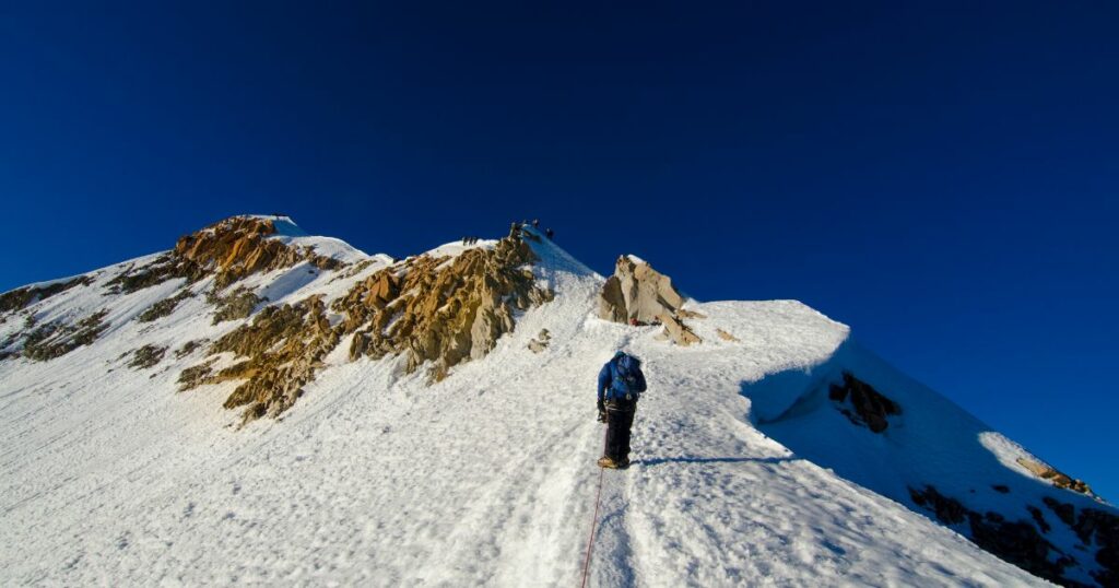Shutterstock Climber in the mountain. Climbing Huayna Potosí