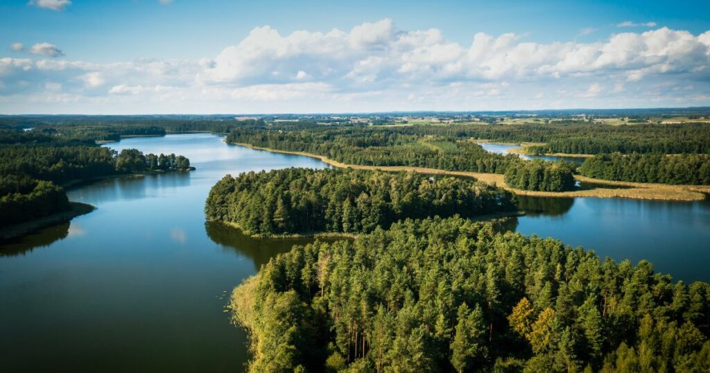 Shutterstock Masuria. Aerial view of green islands and clouds at summer sunny day. Masurian Lake District in Poland.