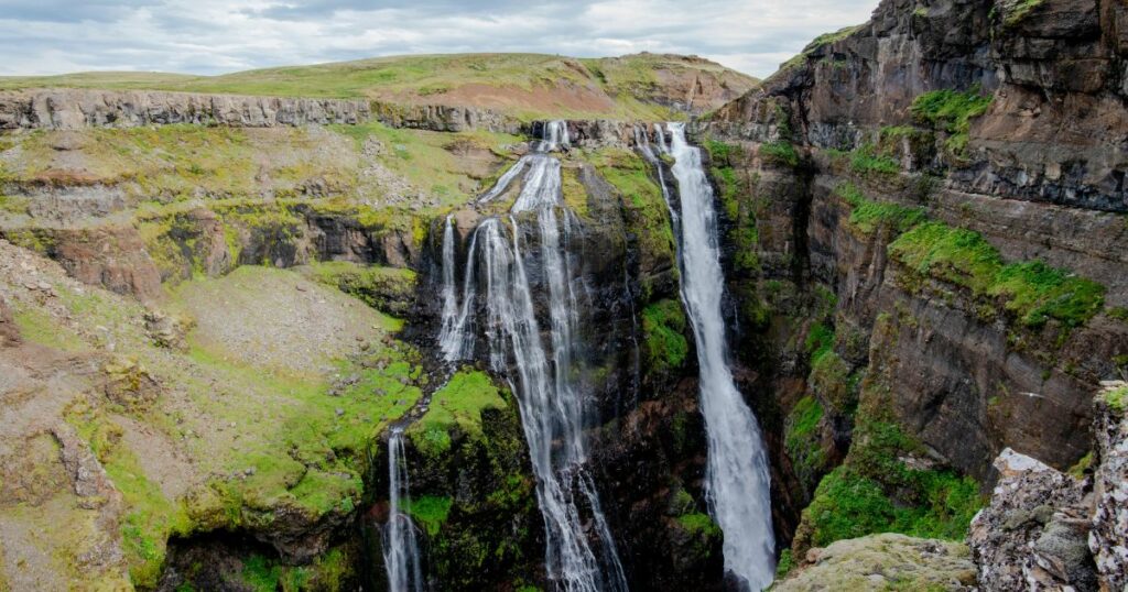 Shutterstock view of the beautiful Glymur waterfalls on the Botsná river from the Hvalvatn lake near the Hvalfjörður fjord in Iceland