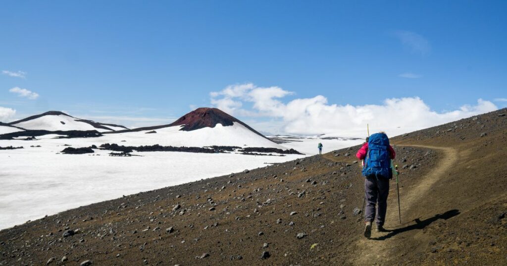 Shutterstock A hiker walking towards Magni crater