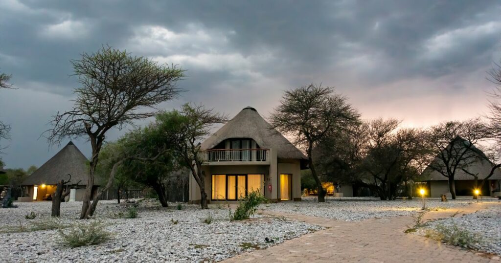 Shutterstock Okaukuejo camp lodges under a cloudy sky, Etosha National Park, Namibia