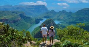 Panorama Route South Africa, Blyde river canyon with the three rondavels, view of three rondavels and the Asian women and Caucasian men on vacation in South Africa