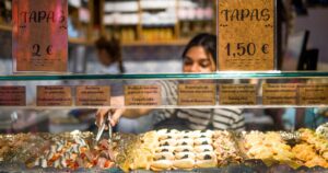 A woman serving tapas on a street in Madrid