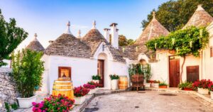 Famous Trulli Houses during a Sunny Day with Bright Blue Sky in Alberobello, Puglia, Italy