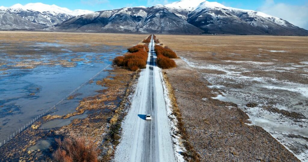 Shutterstock Scenic road in El Calafate, Patagonia, with snow-capped mountains in the background
