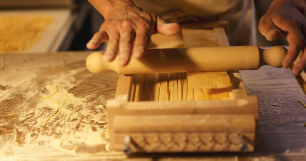 Shutterstock A person making pasta